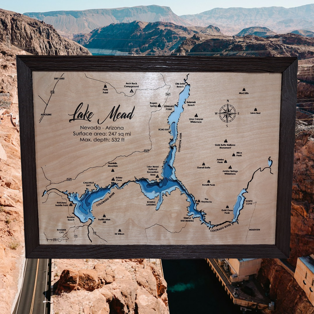 Lake Mead layered bathymetric wood map — Natural Baltic Birch, Charwood (Dark Brown), Hoover Dam scenic background (digital product mockup)